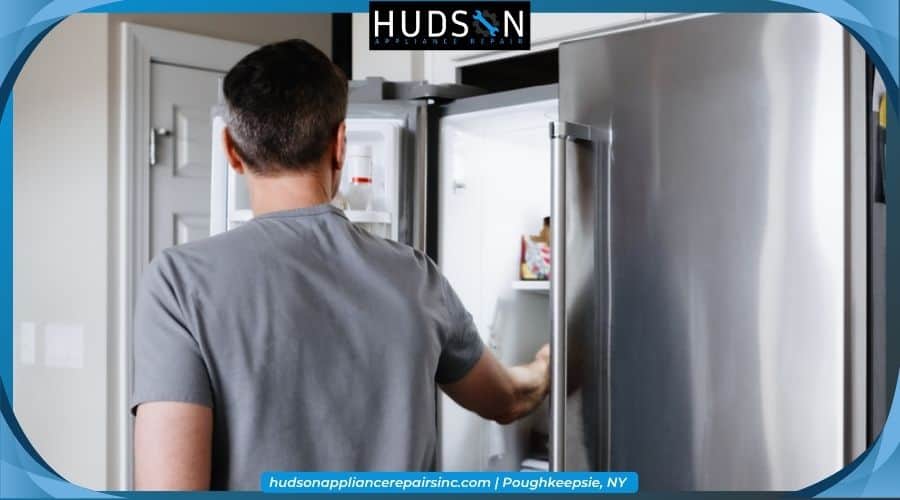 Homeowner examining a new modern appliance in an appliance showroom